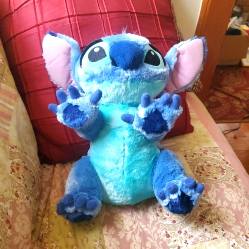 The Walt Disney World Stitch Alien Plush Stuffed Toy is a 12"